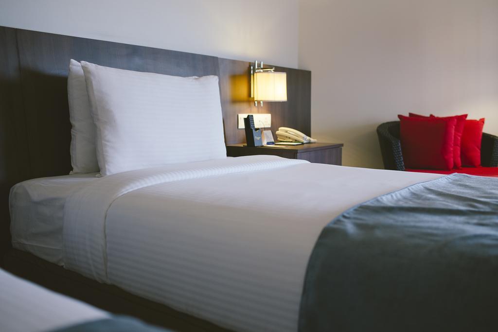 Sand & Sandals Desaru Beach Resort & Spa Eksteriør bilde A bed with a telephone